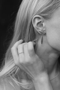 Close Up Photo of a Woman Wearing Earring