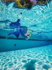 A Mermaid Swimming on a Swimming Pool