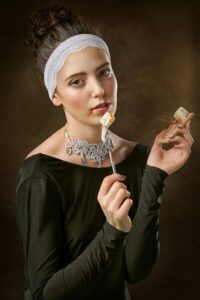 Photo of a Woman Holding Fork And Mousetrap