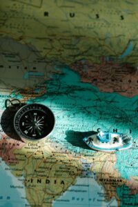 Compass and a Toy Boat on a Map