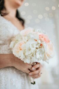 Photo of Woman Holding White Bouquet